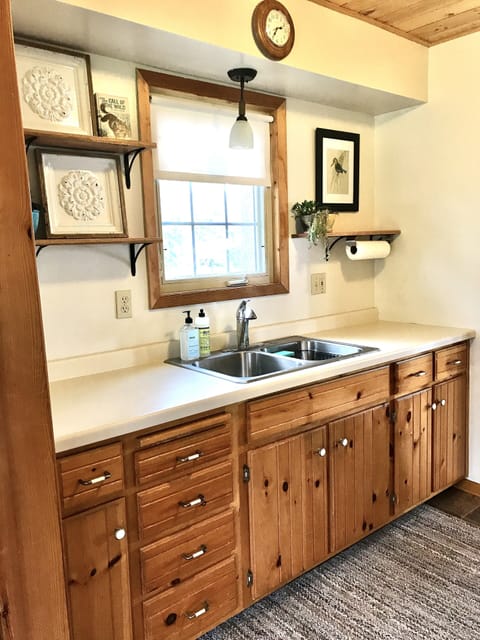 Clean open kitchen window facing canal and lake