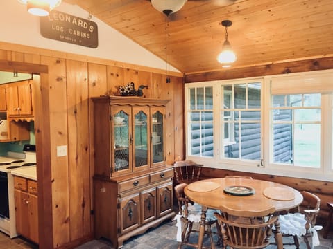 Entry to eating area and kitchen, windows 3 sides with fan