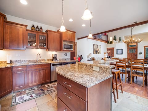 Kitchen with Bar and Two Stools