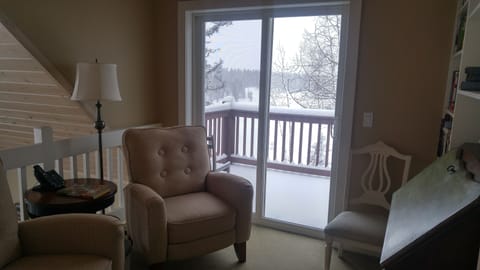 Upper level library with walk out deck