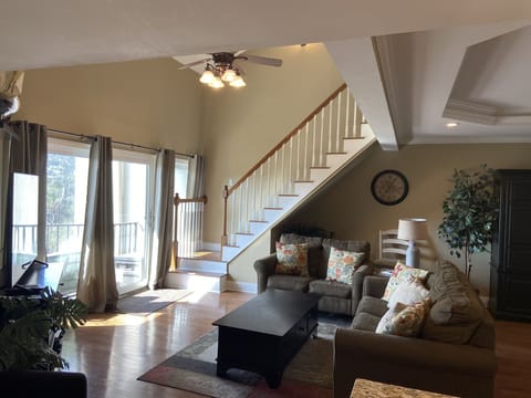 Bright sunny great room with 2 story vaulted ceiling.