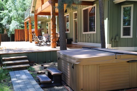 Back deck and hot tub overlooking river