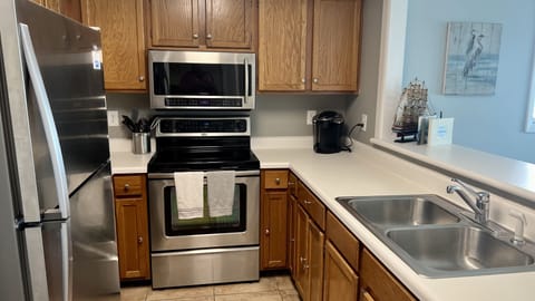 Kitchen is fully stocked with dishes, pots and pans, silverware, utensils, etc