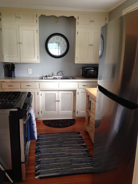 Kitchen with new gas stove and refrigerator