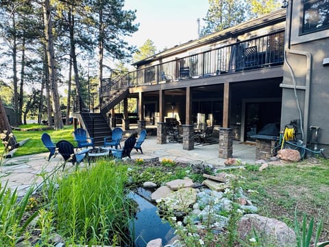 Backyard Oasis with pond and lots of comfortable seating options