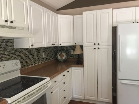 Another view of Spacious kitchen with full sized appliances