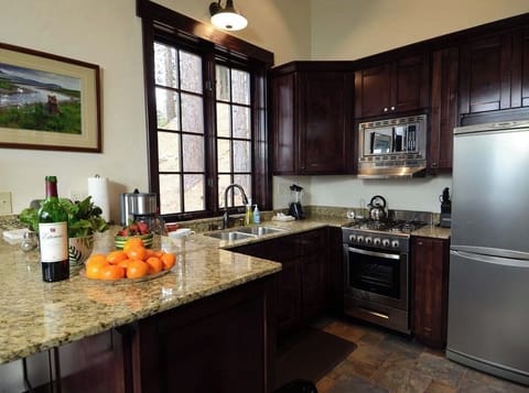 The Breakfast bar is in the full kitchen, with new oven, micro, dishwasher, frig