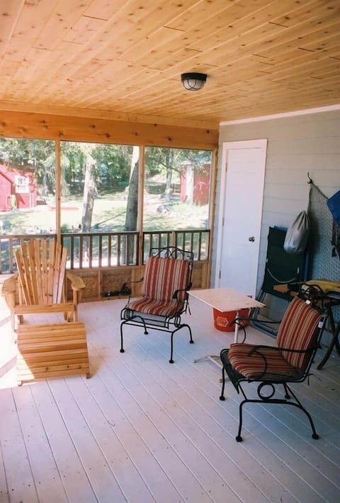 Screened in porch with lake views (to the left in the photo)