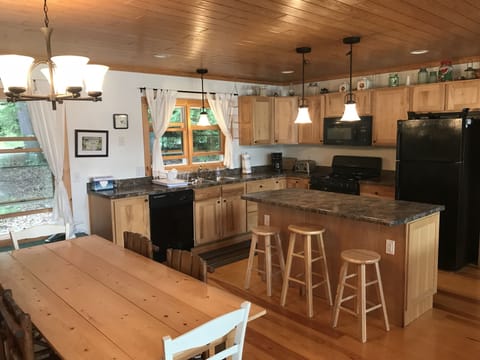 Kitchen and dining area viewed from the corner of the great room
