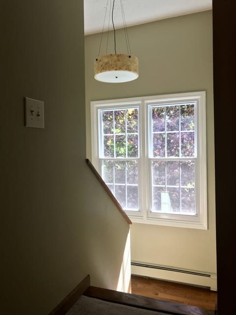 Beautifully, naturally lit stairway to the upper foyer.
