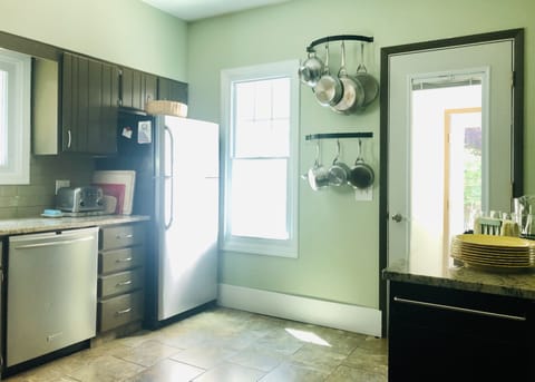 Easy patio access through kitchen. Sunny melamine dishes for out-door dining.