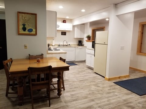 Remodeled kitchen with full range, microwave, and dishwasher.