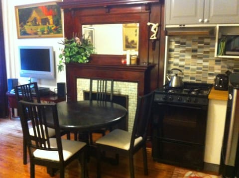 dining table, stove, fireplace, chairs