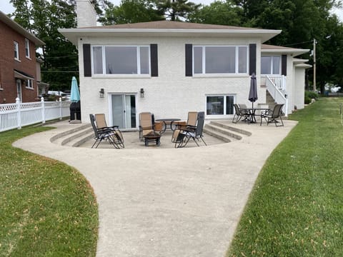 Freshly painted exterior with great patio for BBQ or sitting around fire pit.