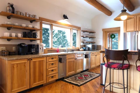 Big airy kitchen with lots of counter space. Fully stocked with the latest wares
