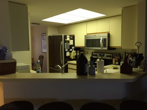 Kitchen view from dining room with breakfast bar