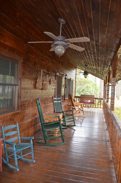 Covered front porch with rockers and a swing. Enjoy nature!