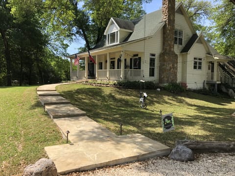 Flagstone walkway from the gravel driveway to the front porch