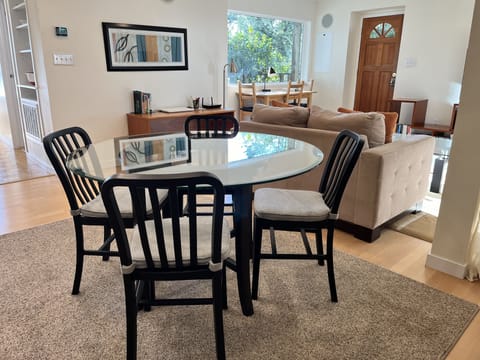 The dining area is convenient to kitchen - and TV!