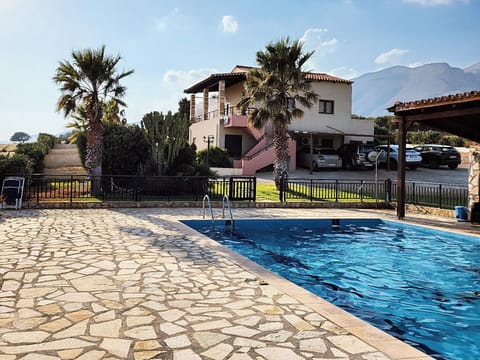 Exterior view of the pool and landscaped garden