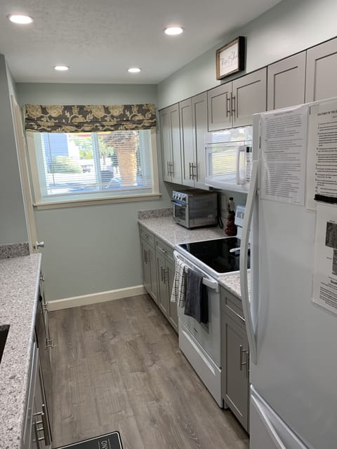 Kitchen full size refrigerator, stove/oven, microwave, air fryer, coffee maker