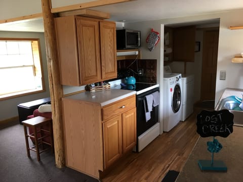 Kitchen with Laundry room behind it.