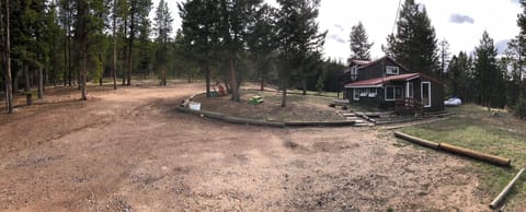 Overview photo of the Cabin. Plenty of parking, sitting and playing areas.