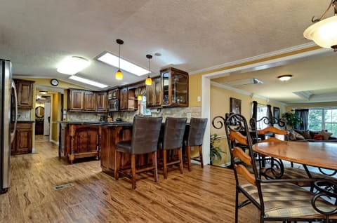 Kitchen, Dining and additional seating at bar area
