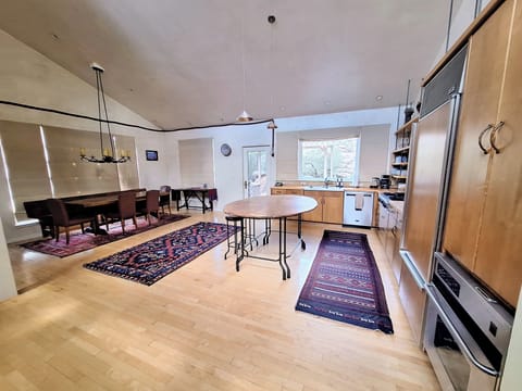 Kitchen and dining room in the open floor plan upstairs
