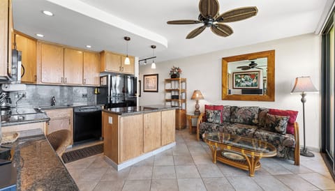 Kitchen with island and granite countertops.