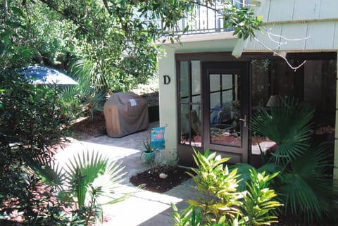Condo entrance surrounded by lush vegetation adding to privacy 