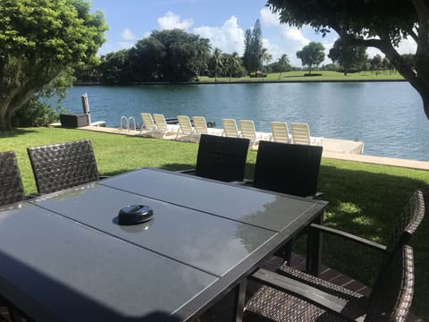 Rear Terrace, Bar Height, 8 Chair Table with View. 