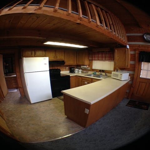 Kitchen with all the appliances needed.  New Stove and Coffee Maker.
