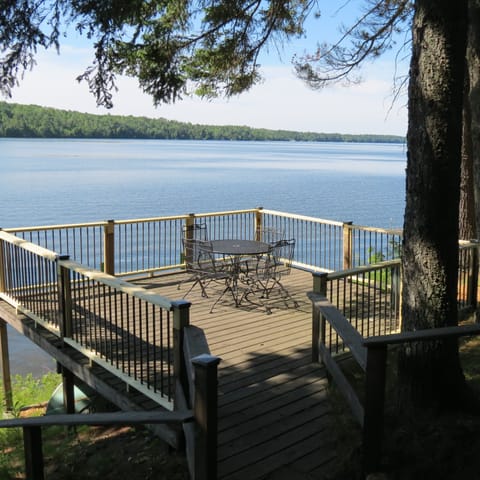 Lake side deck looks out over the swimming area and guest dock.