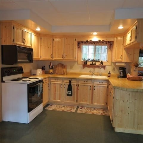 Kitchen is complete with most small appliances like a griddle, crock, blender.