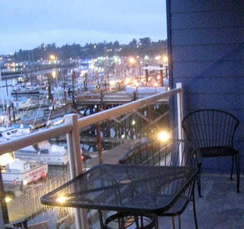 Evening jewel-box view of Old Newport, fishing fleet, bridge, Bay from deck