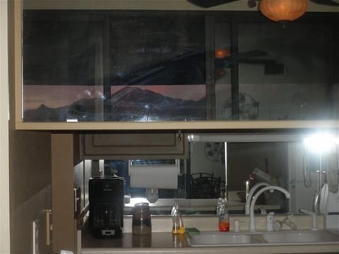 Reflection of the mountain in the mirror over the window into the kitchen!!