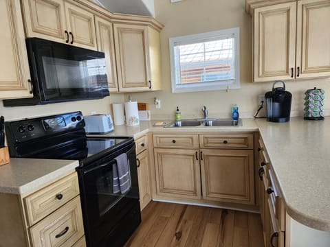 Fully stocked kitchen along with a Keurig and a large selection of K-cups.