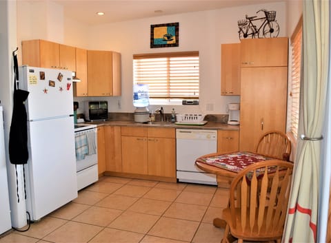 Full Kitchen with all you need to make meals and dine at home.