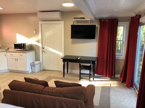 Front door with A/C and Heating system, LED TV and dining table