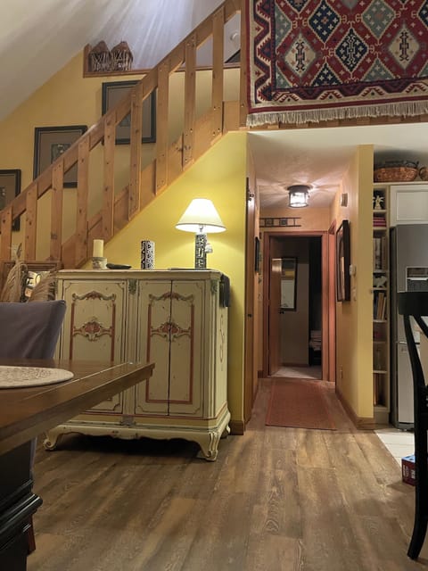 Dining area with staircase to loft