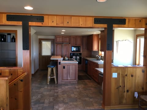 Living room facing into kitchen 