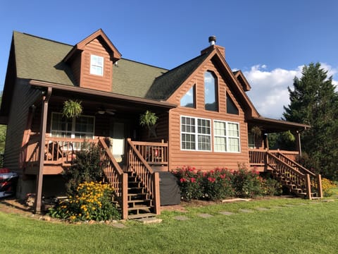 Back side of Cabin.  2 separate porches and Large Gas Grill.