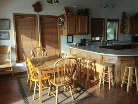 Teak dinning table in Kitchen that expands and seats 8