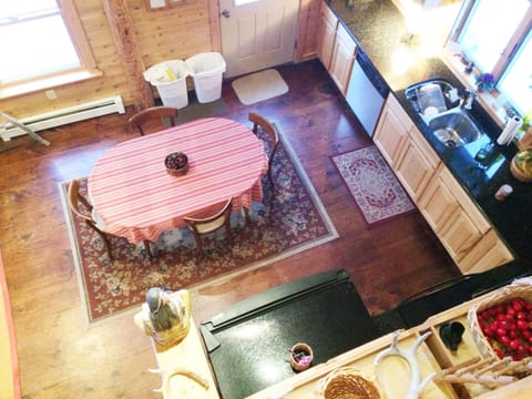 Dinning table near kitchen equipped with granite counter tops
