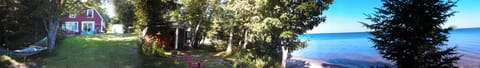 Panoramic view.  Not shown is the screen house side of lot (to left of hammock)