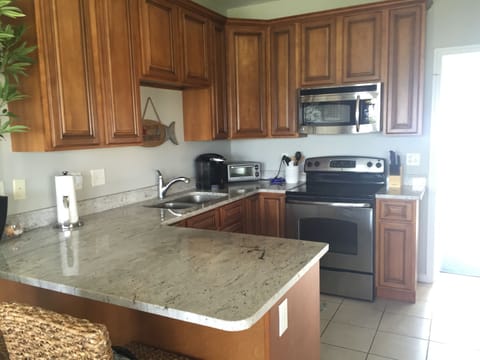 2nd Floor - Fully equipped kitchen featuring granite countertops. 