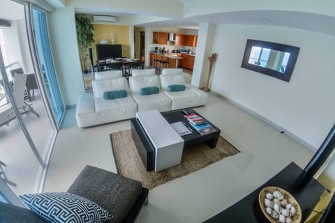 Villa 9B family room with 70" Smart TV and US Dish programming