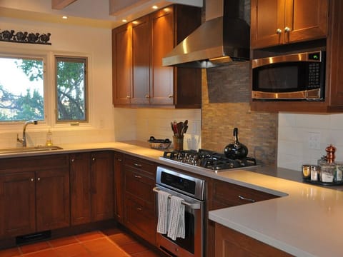 More cabinet and counter space and a five burner stove!