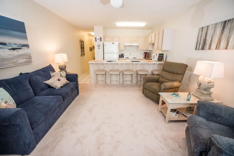 View of living room and kitchen from balcony.